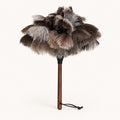 Luvamira Select Handheld ostrich feather duster standing upright on a warm off-white background.