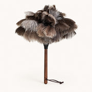 Luvamira Select Handheld ostrich feather duster standing upright on a warm off-white background.