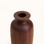Opening detail of Luvamira dark curved wood duster stand