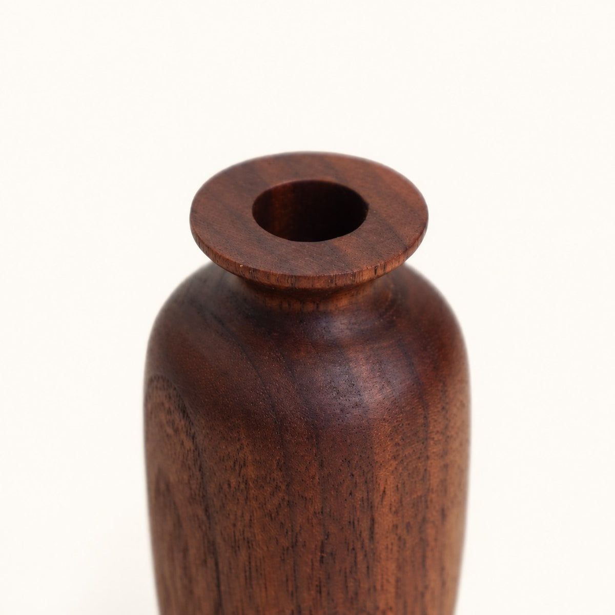 Opening detail of Luvamira dark curved wood duster stand
