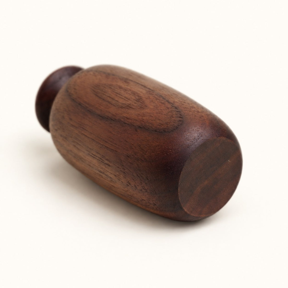 Base and wood grain detail of Luvamira dark curved wood duster stand