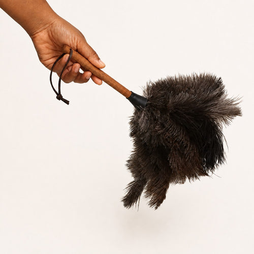 Luvamira Essential Handheld ostrich feather duster held in hand to show size and comfortable grip.