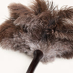 Top-down close-up of layered ostrich feathers on the Luvamira Bamboo Reach duster.