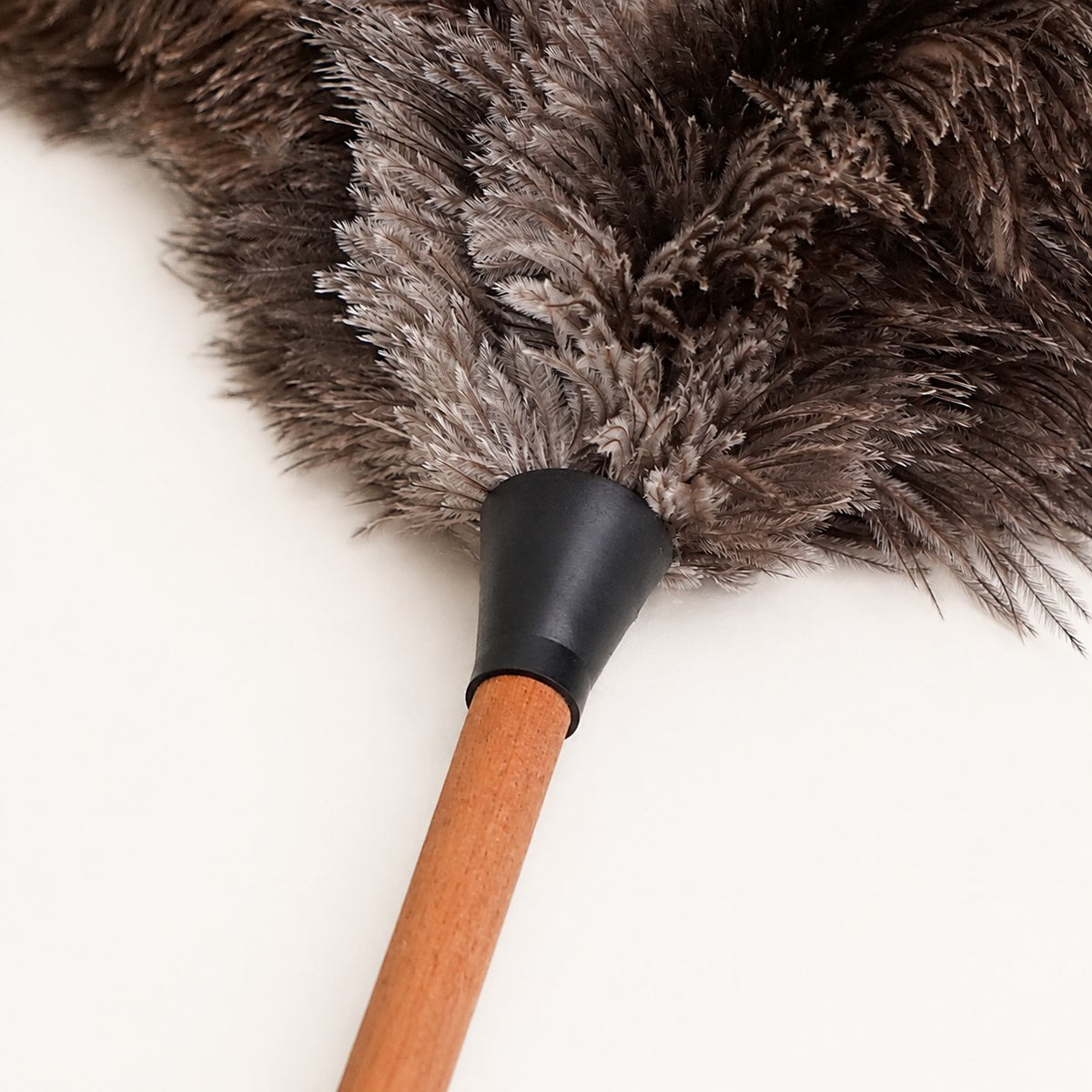 Close-up of the feather roots and black connector on the Luvamira Essential Handheld duster.