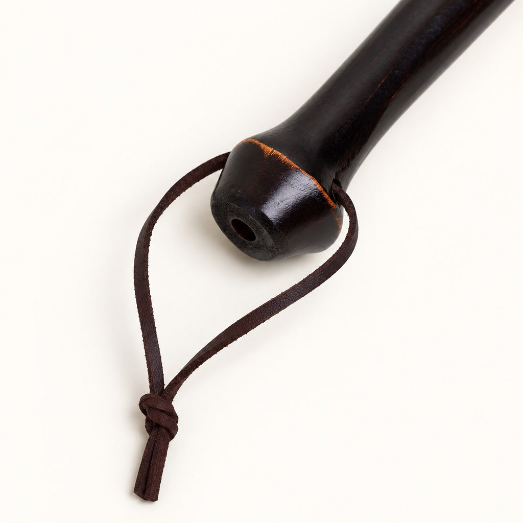 Rounded bamboo handle end and leather hanging loop detail on the Bamboo Reach duster.