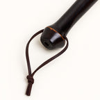 Rounded bamboo handle end and leather hanging loop detail on the Bamboo Reach duster.