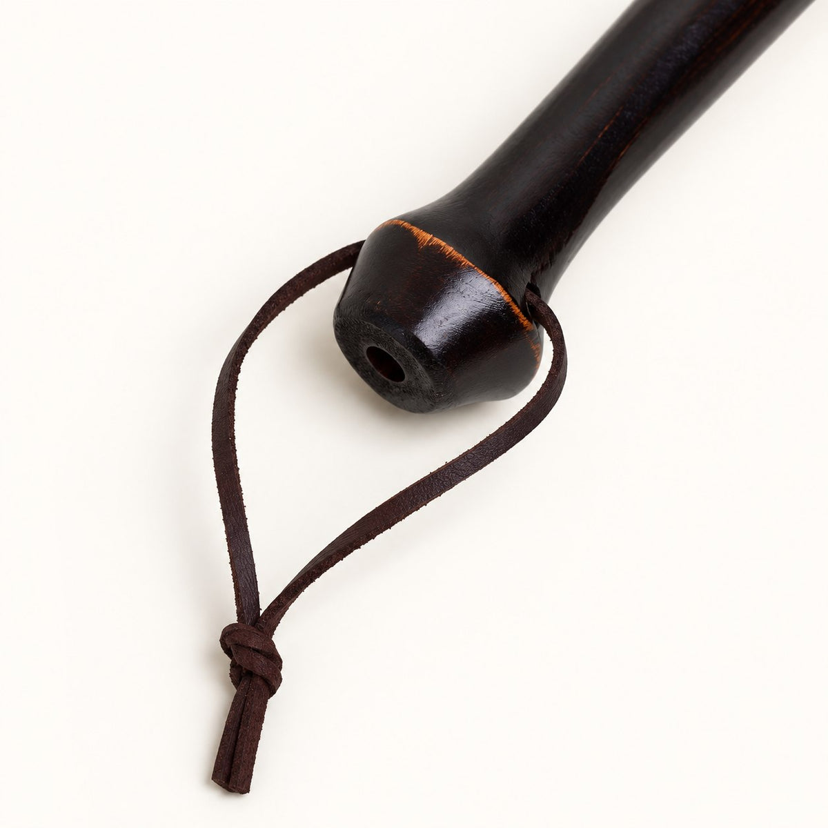 Rounded bamboo handle end and leather hanging loop detail on the Bamboo Reach duster.